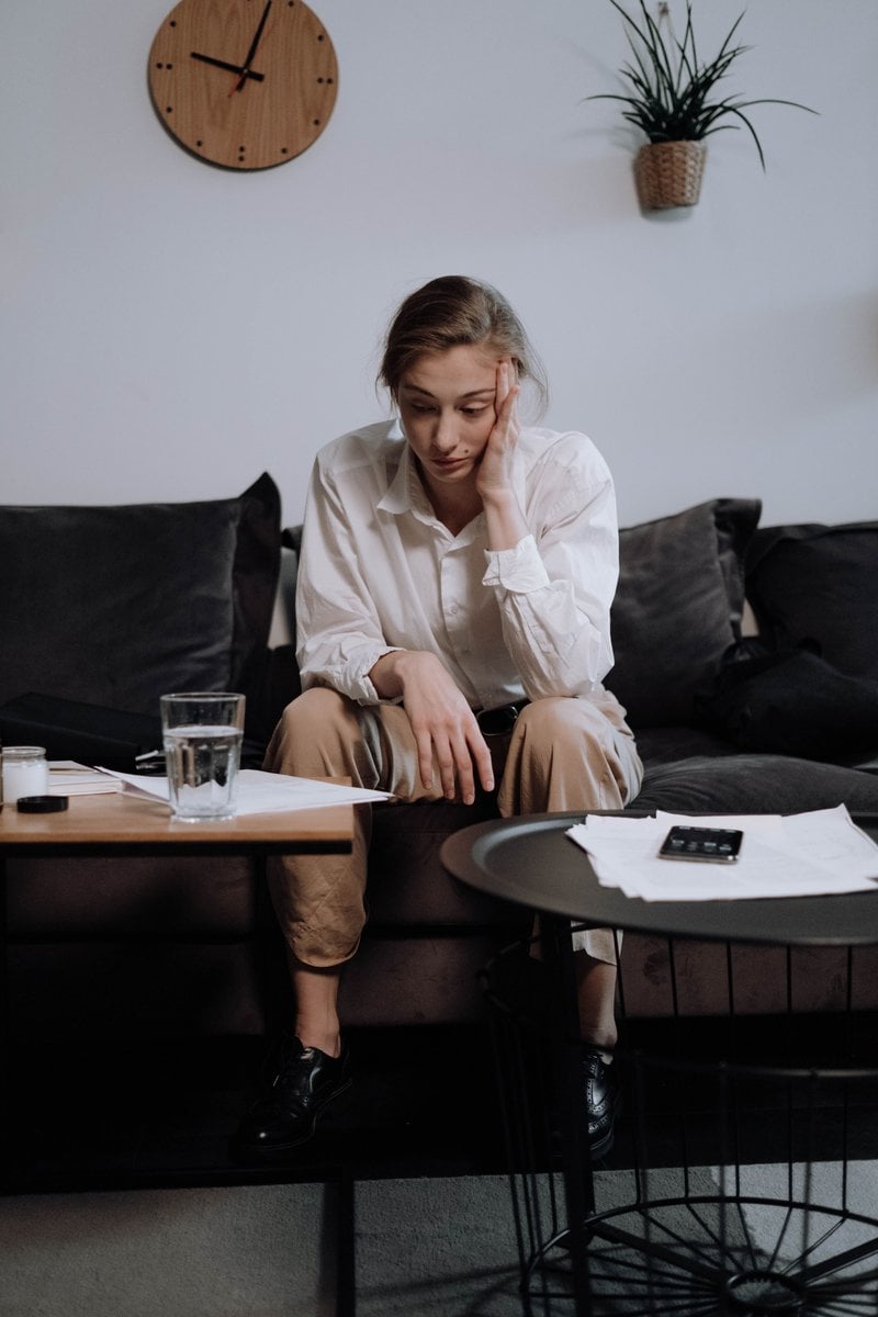 A Woman with Problems Sitting on the Sofa &middot; Free Stock Photo