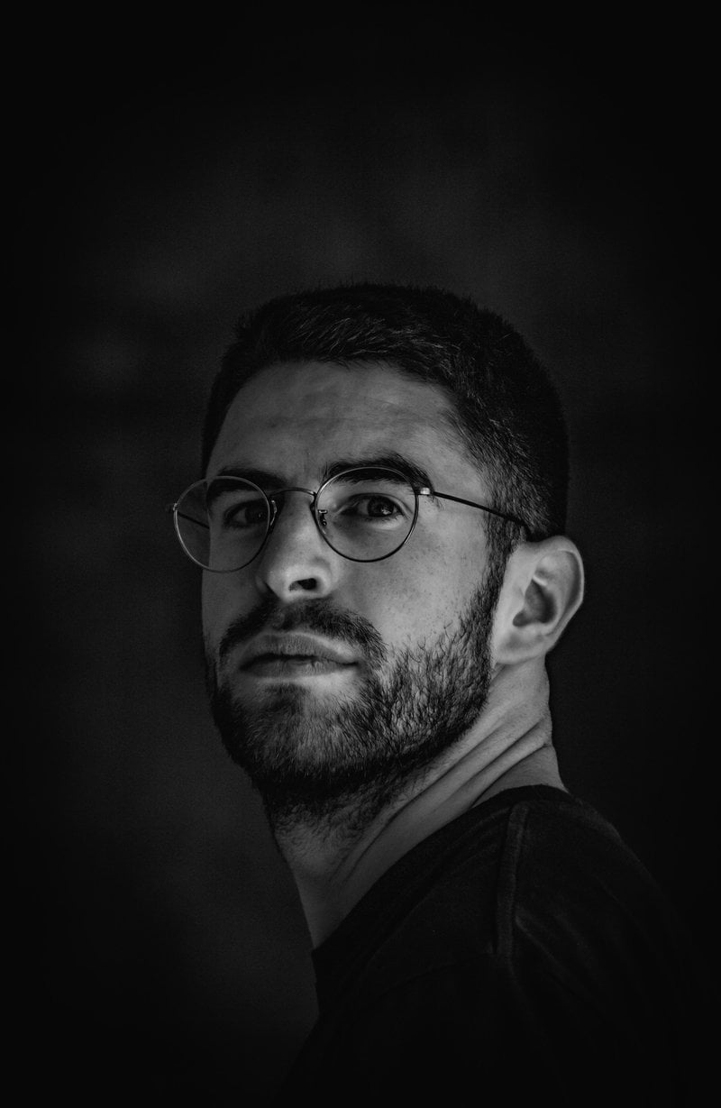 A black and white photo of a man with glasses - Free Photo ...
