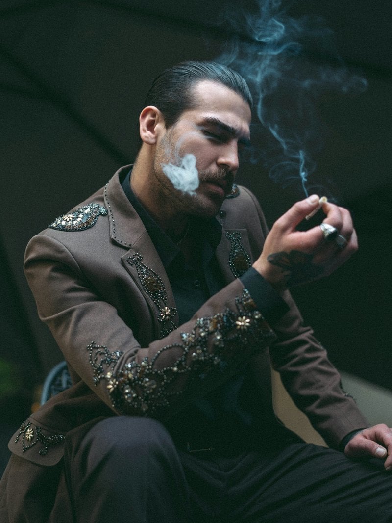 A stylish man exhales smoke from a cigarette. photo &ndash; Free Man Image on  Unsplash