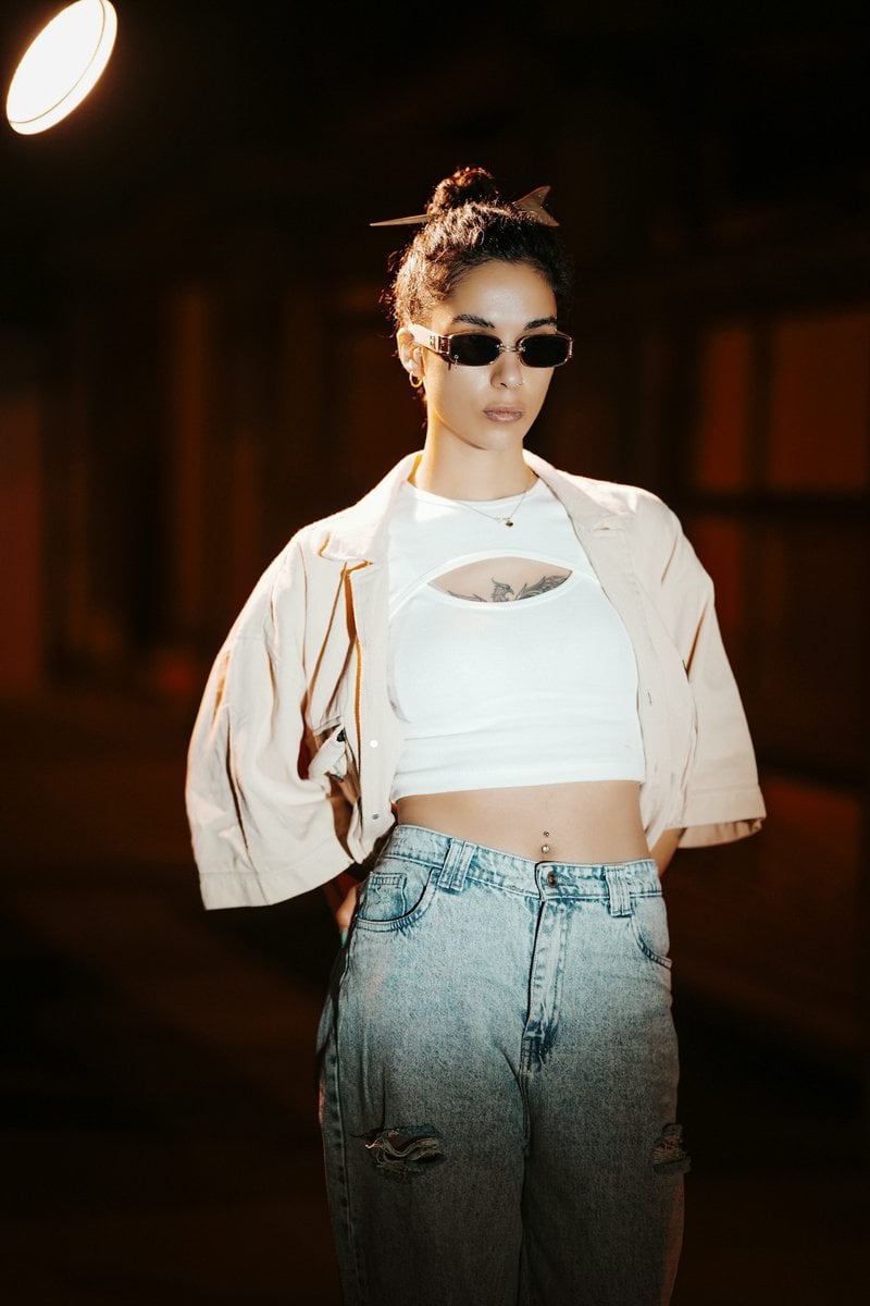 A woman in sunglasses and stylish clothing stands confidently. photo &ndash; Free  Fashion Image on Unsplash