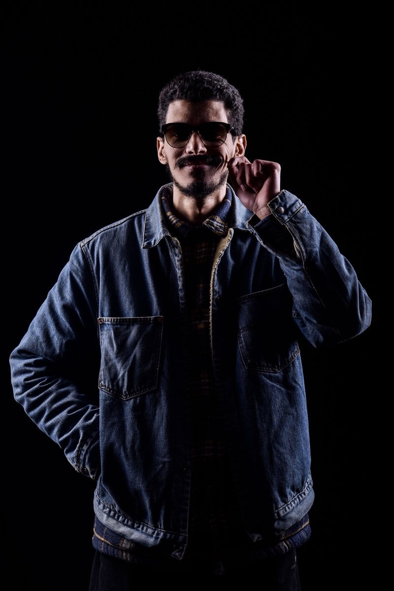 Cool Stylish Man in Denim Jacket on Dark Background &middot; Free Stock Photo