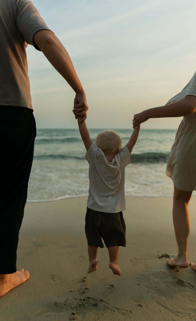 Family Walk Holding Hands on the Beach &middot; Free Stock Photo