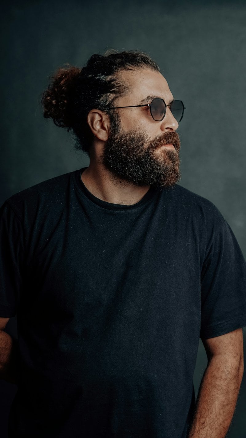 Man with sunglasses and a beard poses. - Free Photo on Unsplash