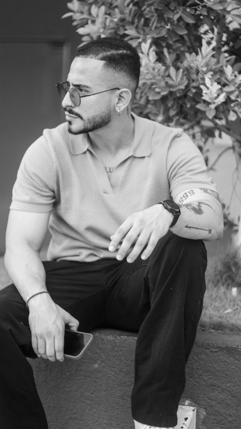 Man with tattoos wearing sunglasses and polo shirt. - Free Photo on Unsplash