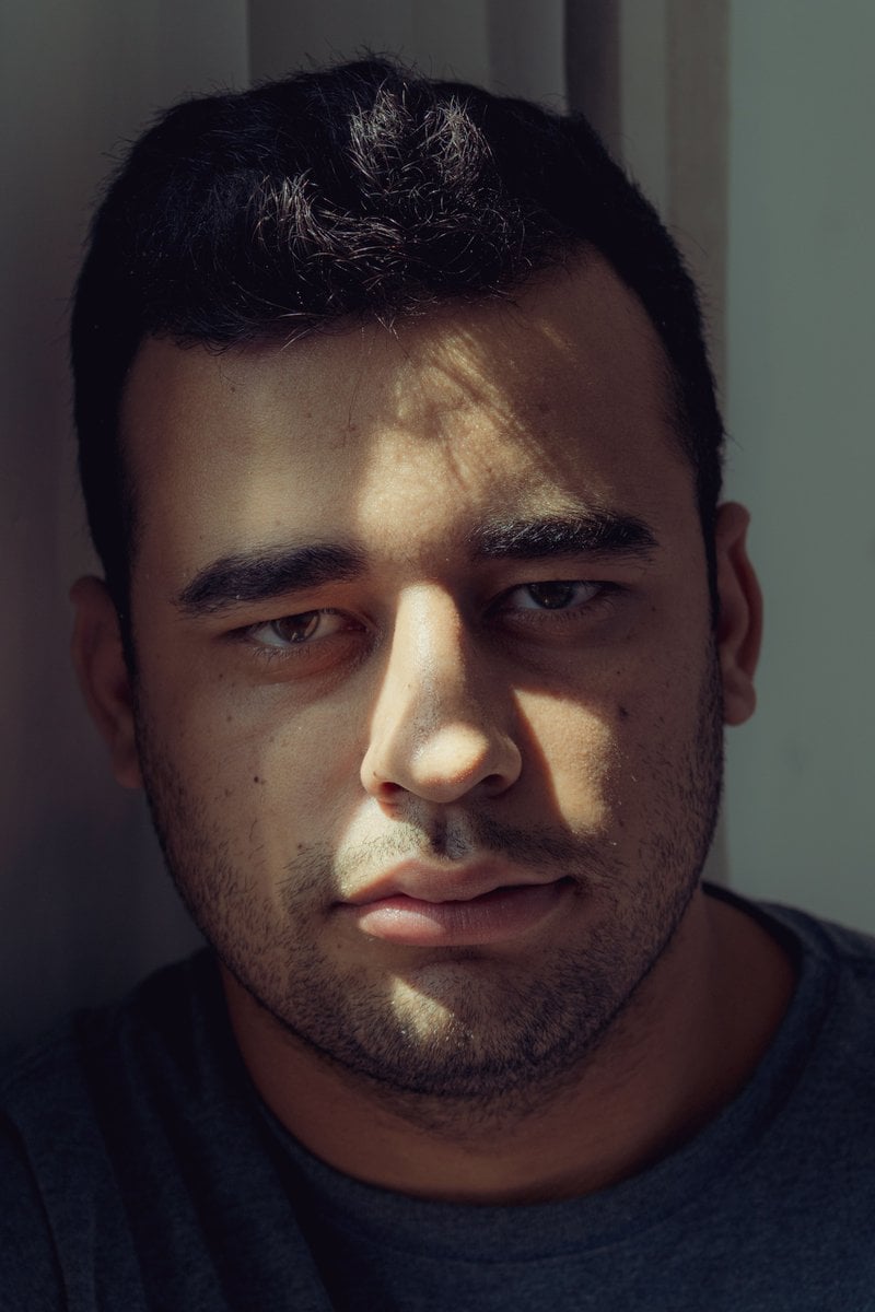 Serious Man in Red Crew Neck Shirt &middot; Free Stock Photo