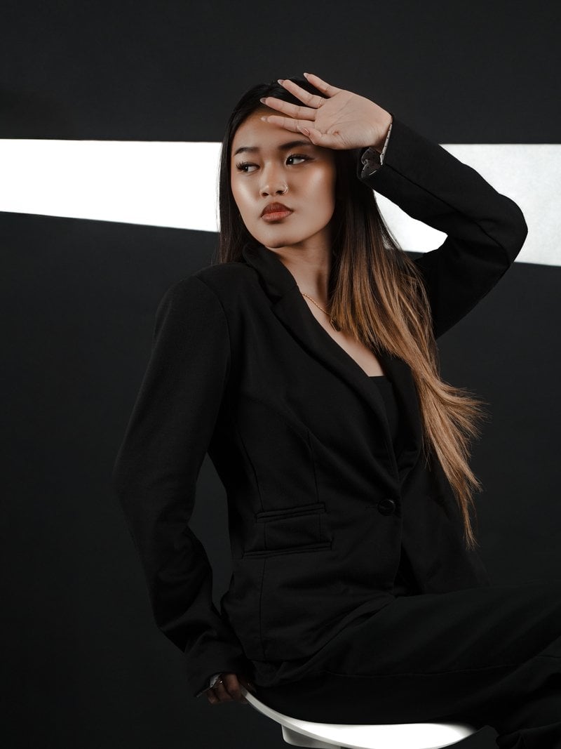 Stylish Woman Posing in Elegant Black Suit &middot; Free Stock Photo