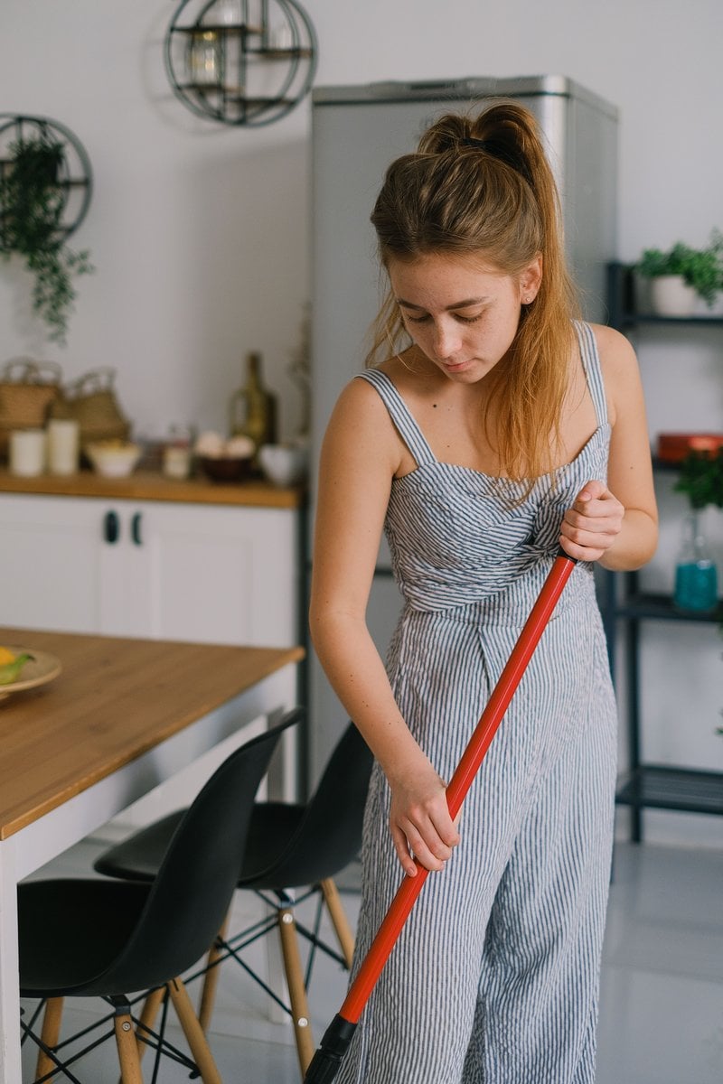 Tired housewife touching head during housework in room &middot; Free Stock Photo