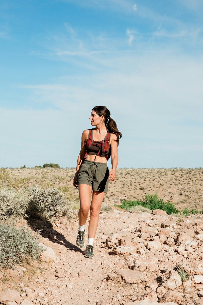 Woman hikes on a desert trail under a blue sky. - Free Photo ...