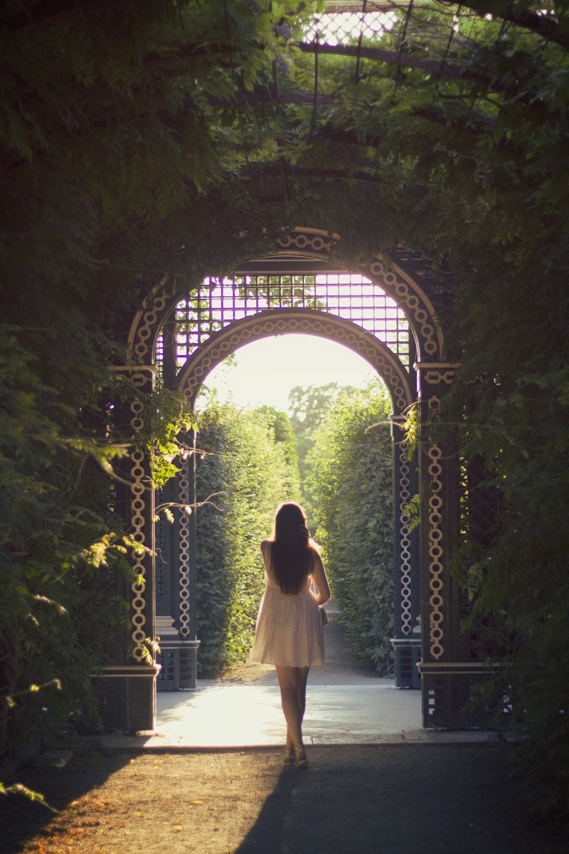 Woman walking alone on pathway photo &ndash; Free Woman Image on Unsplash
