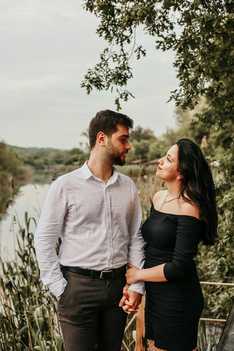 A man and a woman standing next to each other - Free Photo on Unsplash