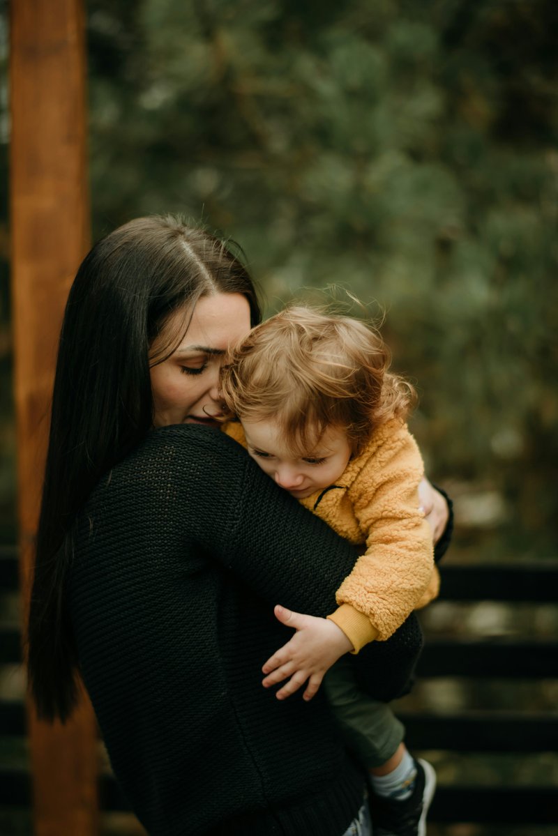 A woman holding a small child in her arms photo &ndash; Free Photography Image on  Unsplash