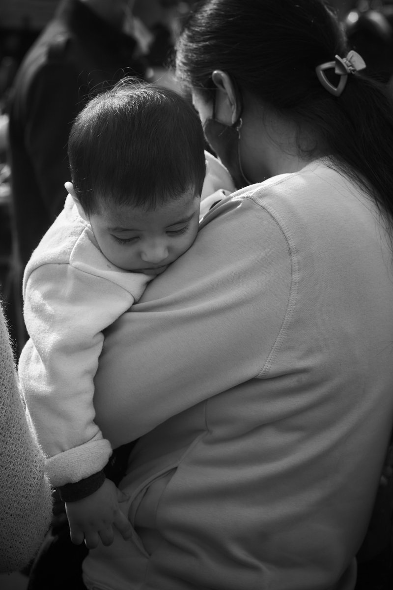 Distressed Mother carrying her Child &middot; Free Stock Photo