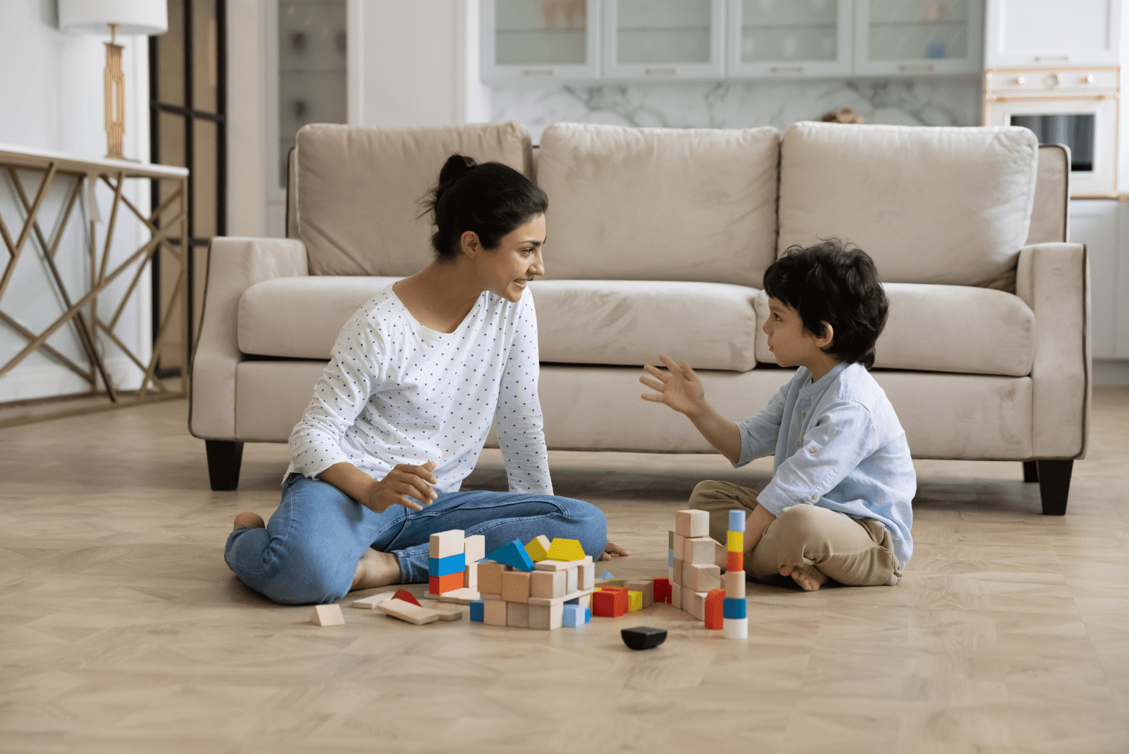 a woman is playing with a child